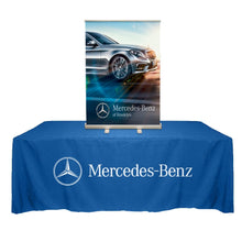 Load image into Gallery viewer, tabletop banner standing on top of a table covered with blue table throw