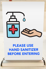 Load image into Gallery viewer, A3 size tabletop banner with graphic asking to 'Please Use Hand Sanitizer Before Entering'