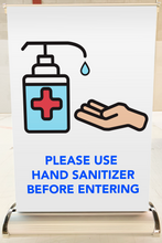 Load image into Gallery viewer, A3 size tabletop banner with graphic asking to &#39;Please Use Hand Sanitizer Before Entering&#39;